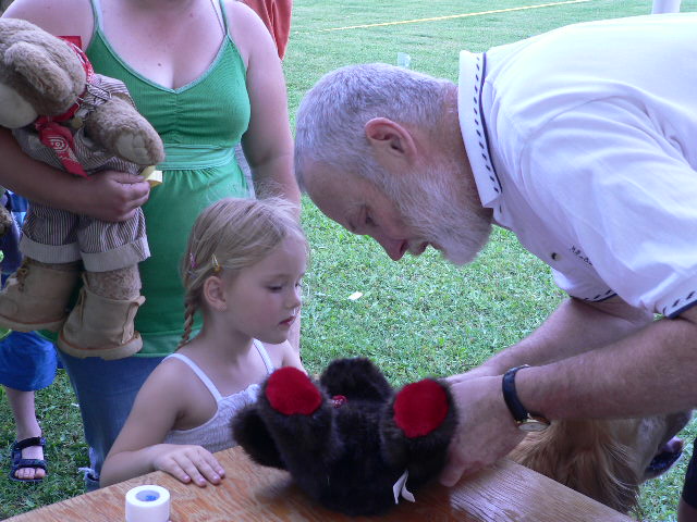 doctor mends a sick teddy bear